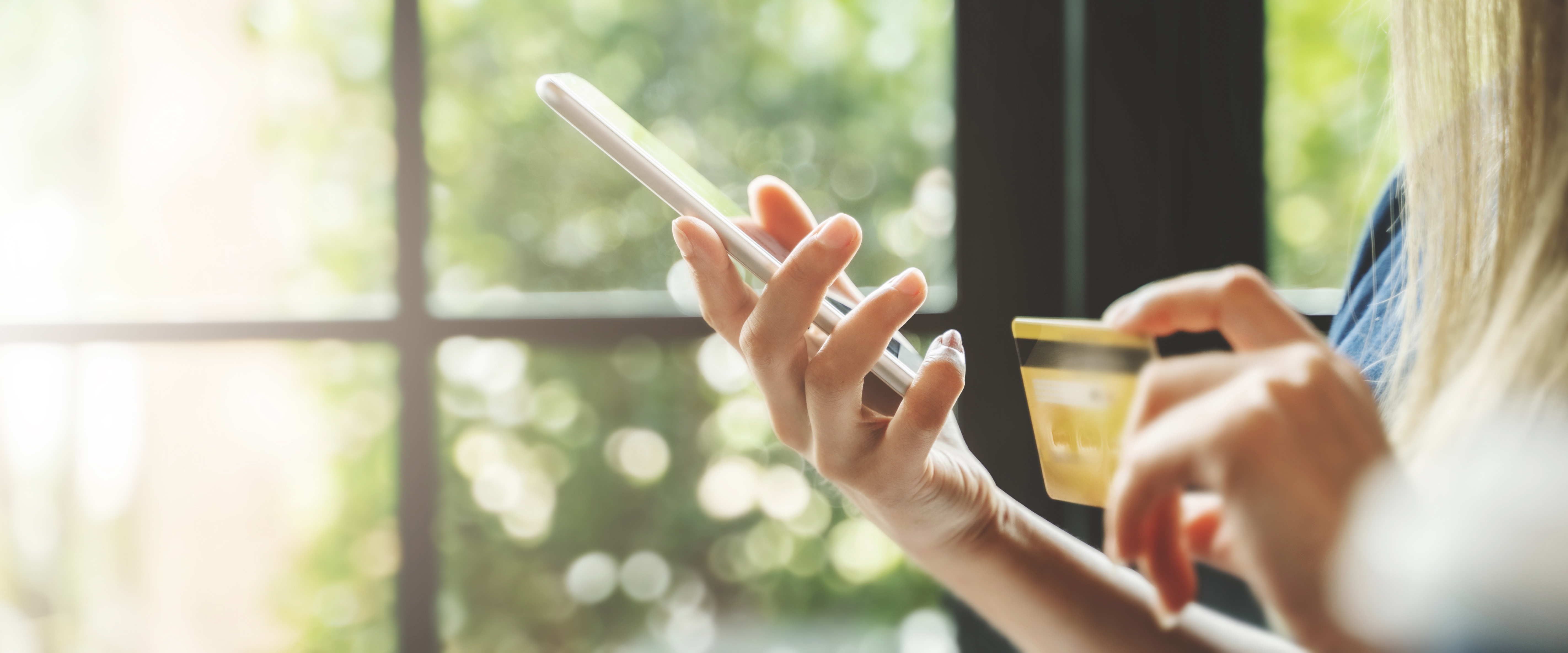 Lady on cell phone with card