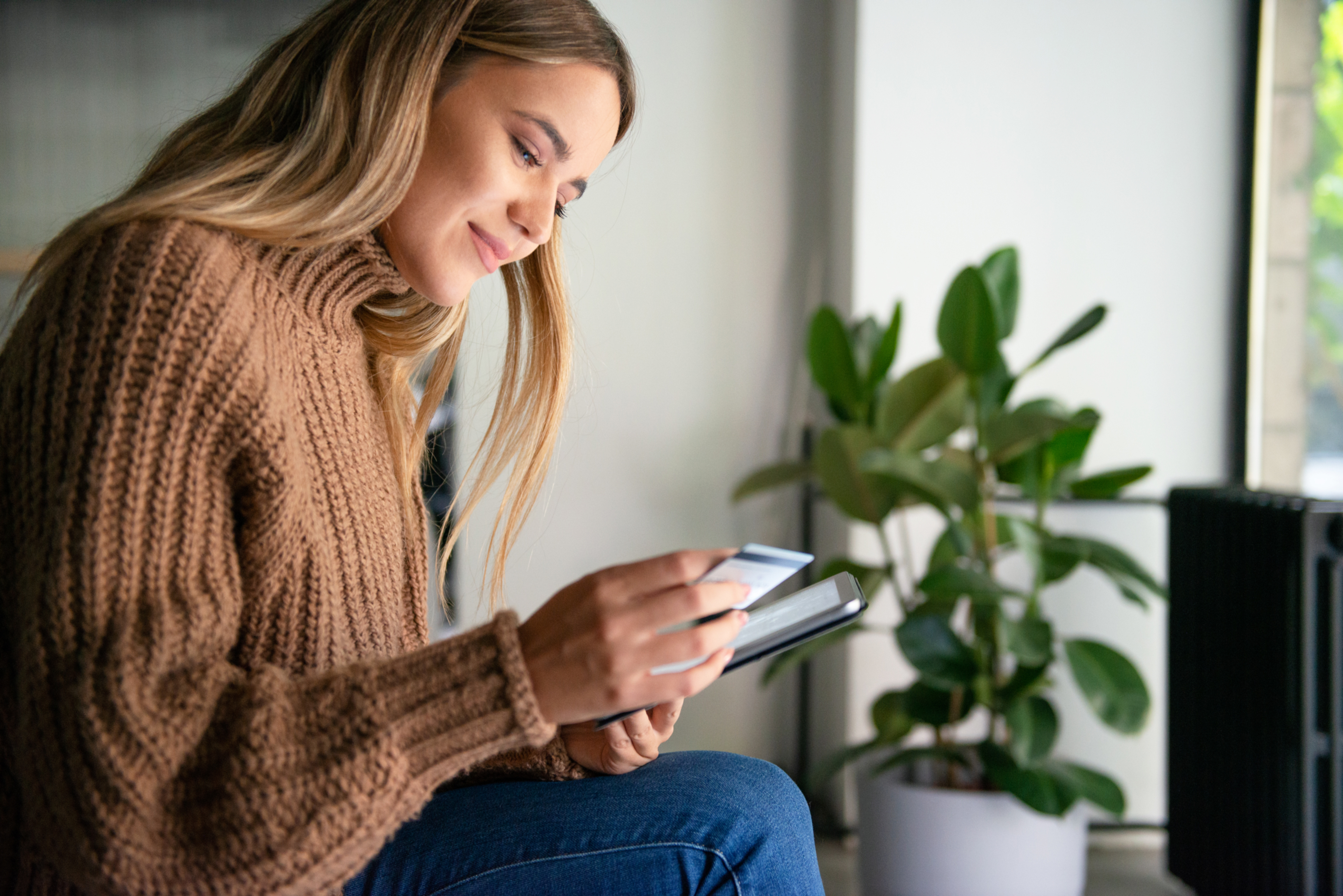 Female on Ipad with Card