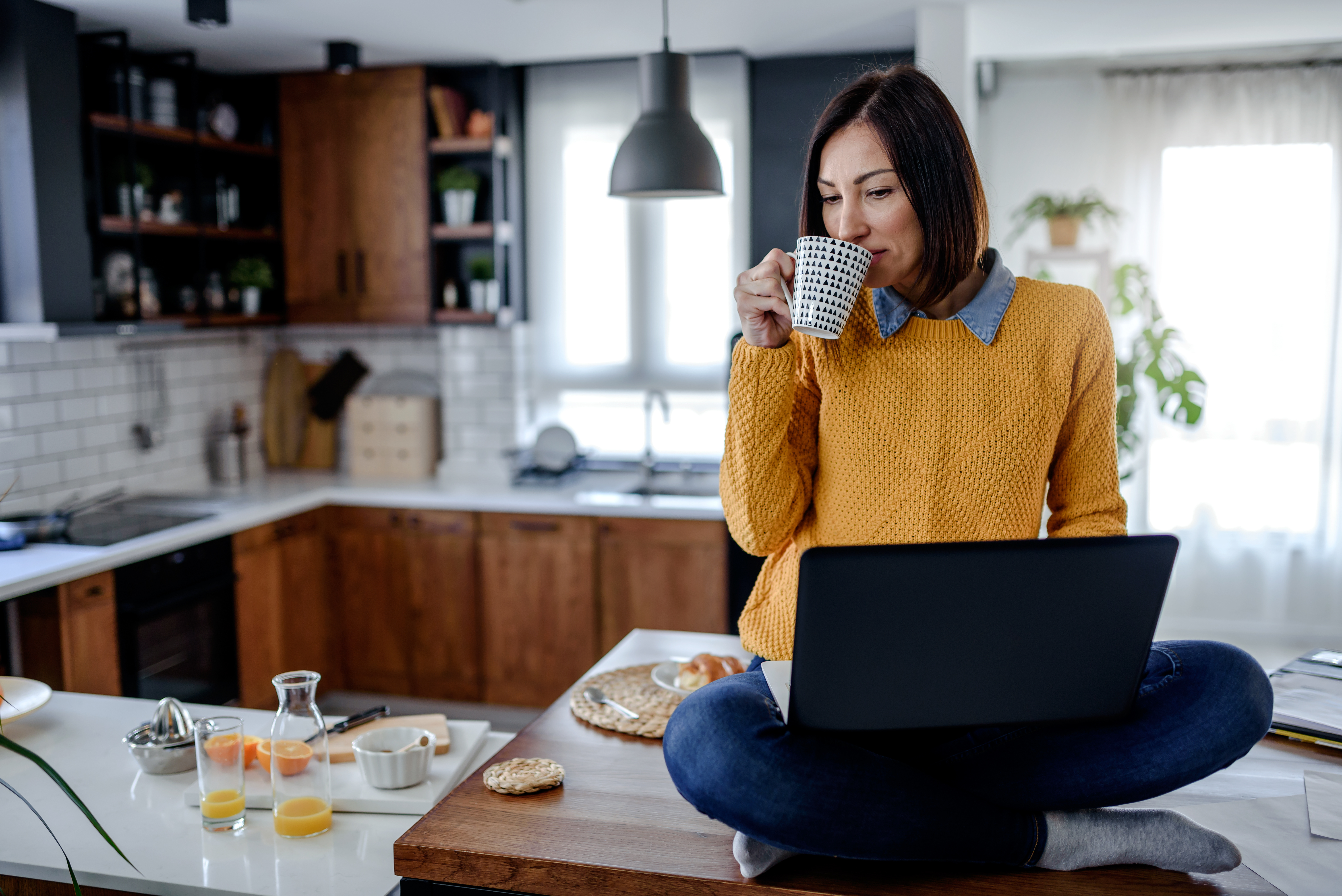 Female - In Kitchen on Laptop