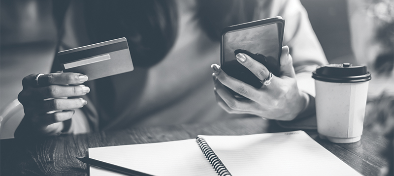 Female on phone with credit card