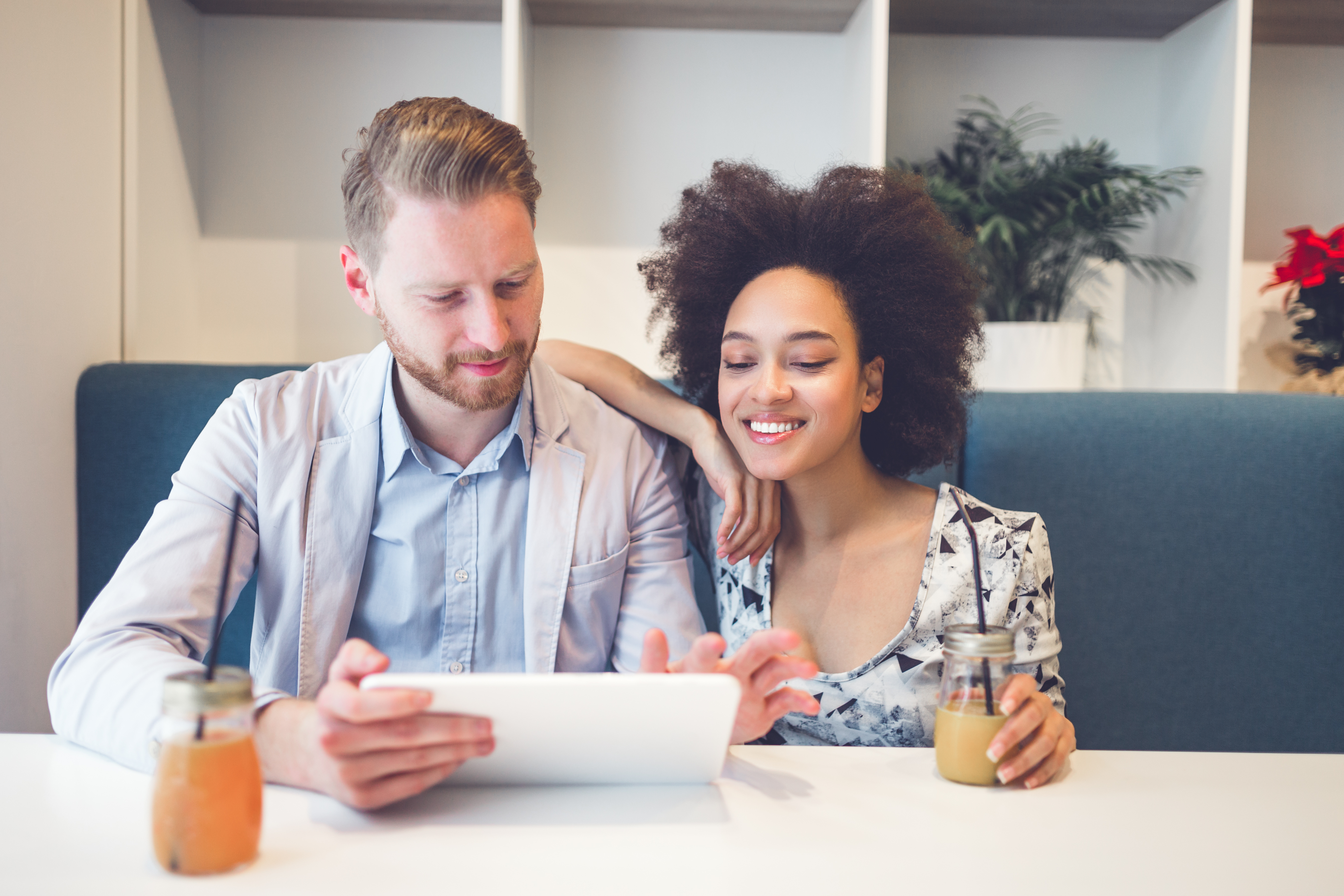 Couple on Tablet with Coffee